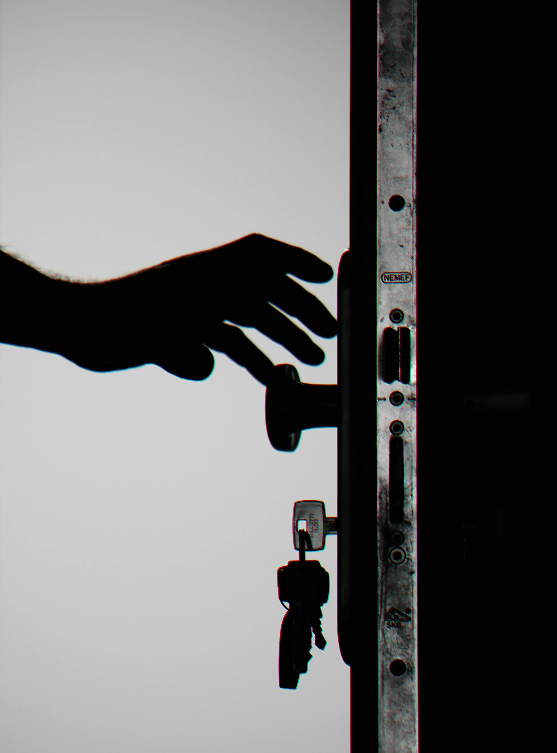 a hand opening a door