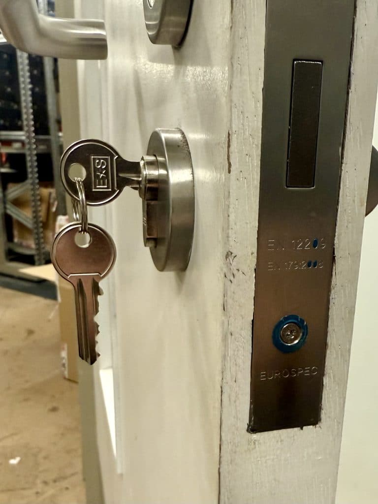 Newcastle Commercial & Residential Lockout Specialists, Fire-Rated Hardware Installed Properly Newcastle Commercial & Residential Lockout Specialists was called to Foot Locker in Eldon Square, Newcastle, to inspect and replace the lock on their internal office fire door. Retail units inside the shopping centre rely heavily on compliant, well-maintained fire doors, not just for staff safety, but to meet the strict standards set by centre management and insurance requirements. This door had a worn, non-compliant cylinder fitted previously, so the store requested a full inspection and an upgrade to a fire-rated, egress-compliant Eurospec lock with a key / thumb-turn cylinder designed for commercial fire doors.